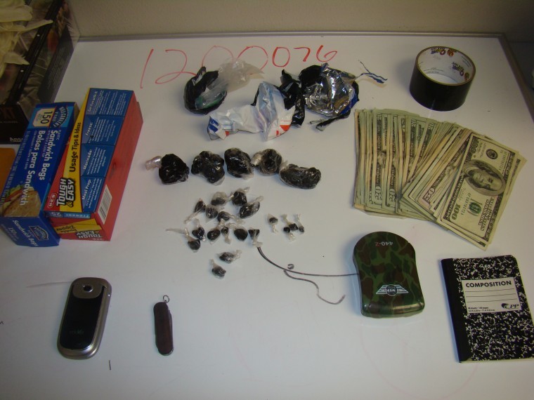seized black tar heroin and cash